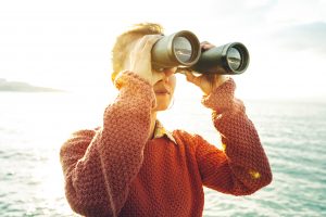 Girl Looking Through Binoculars